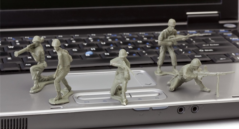 open-laptop-computer-with-toy-soldiers